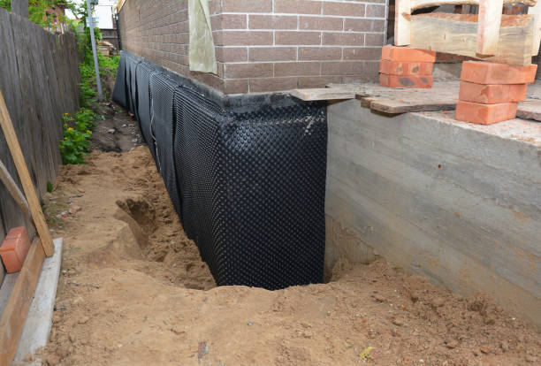 Happy homeowners after waterproofing job in Waynesville